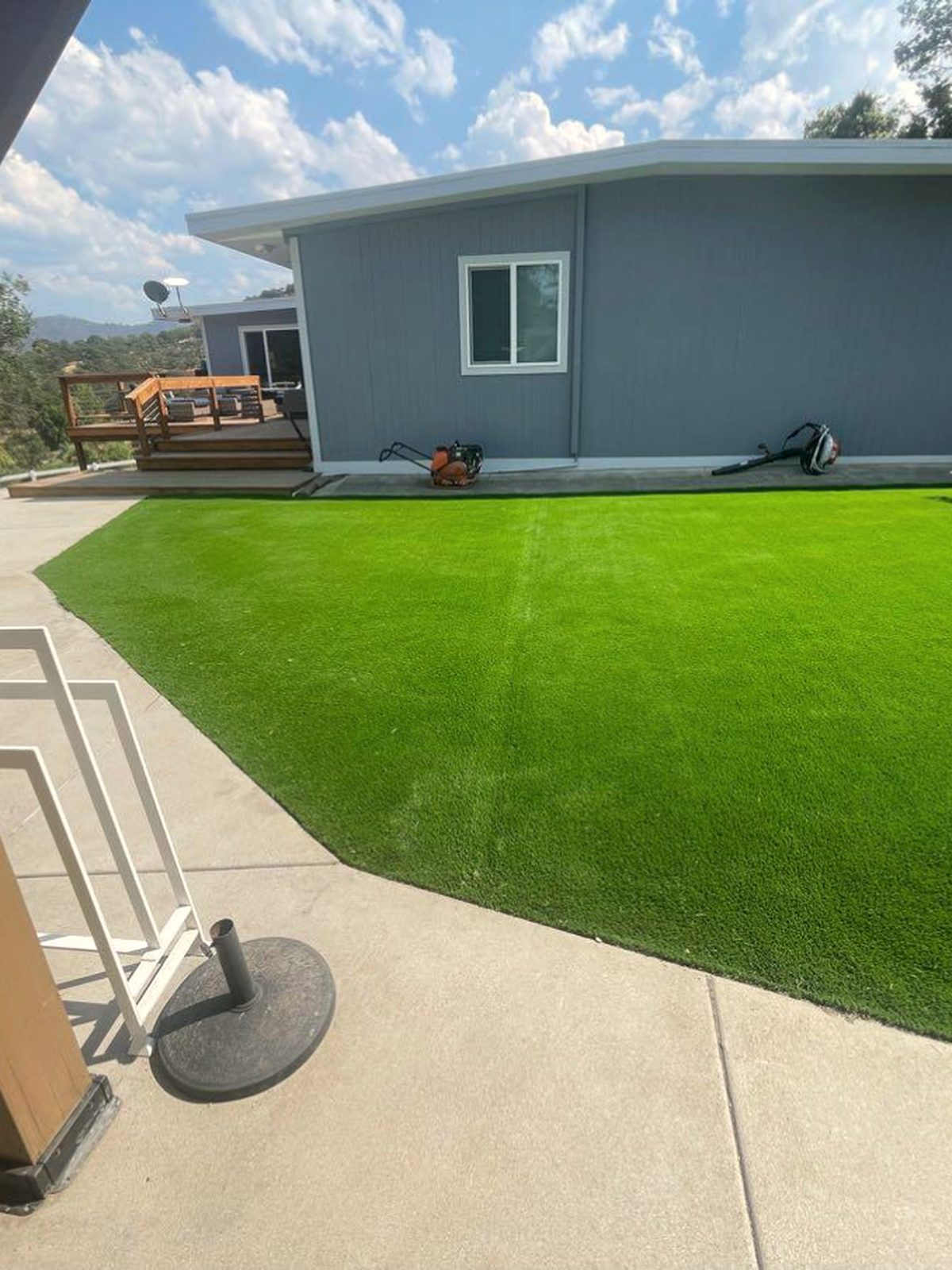 Freshly renovated residential lawn bordered by tended planting beds, Medford Oregon