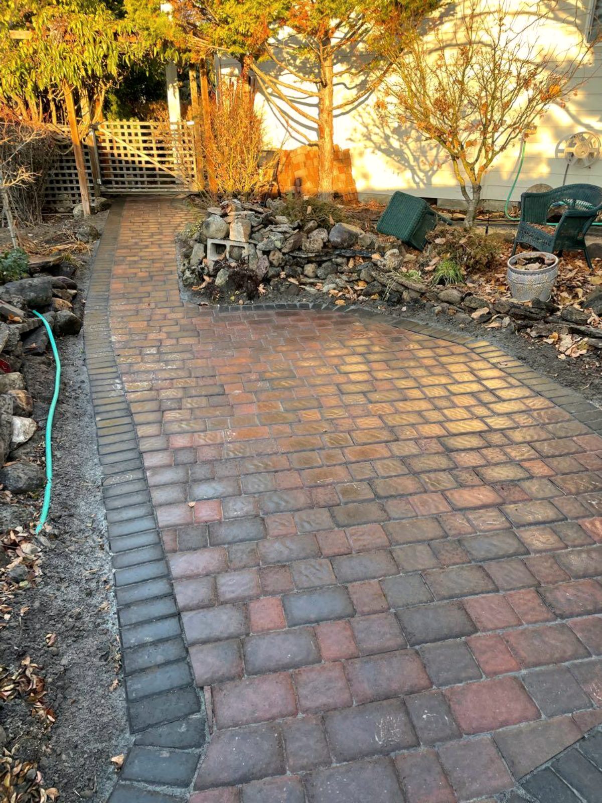 Paver walkway curving through planted beds, Medford Oregon