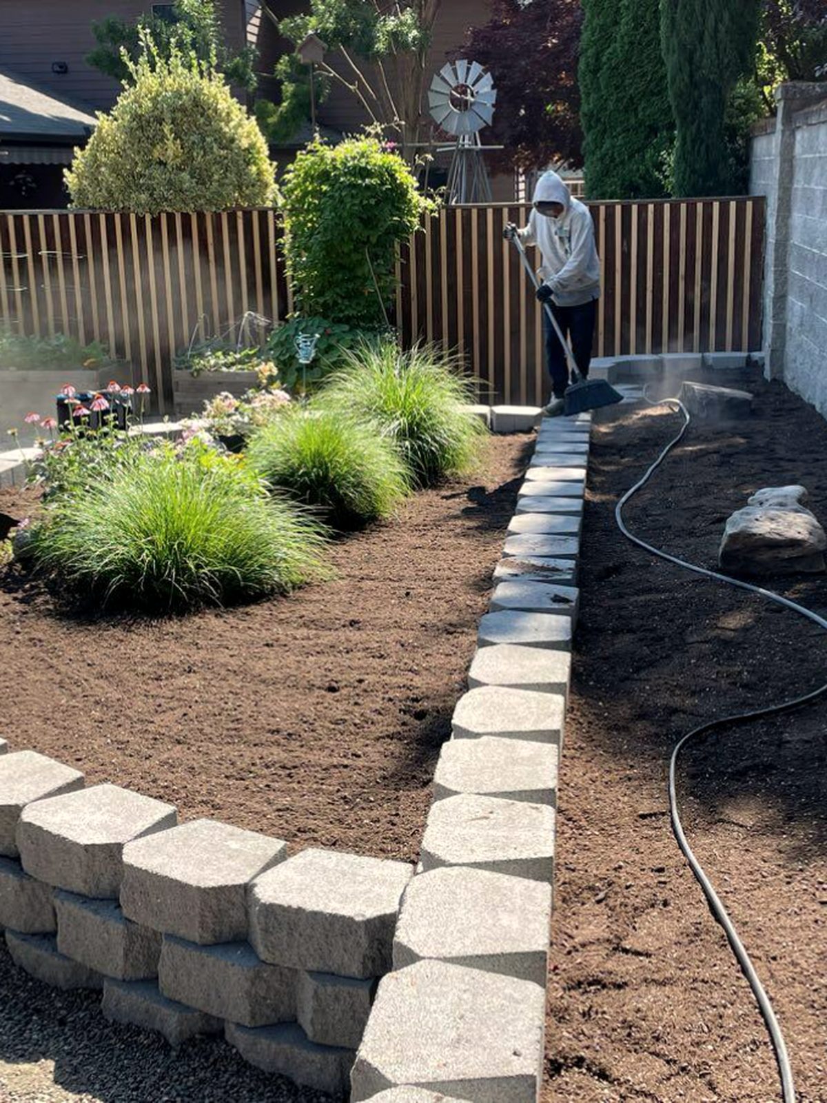 Stacked stone retaining wall on a sloped property, Southern Oregon